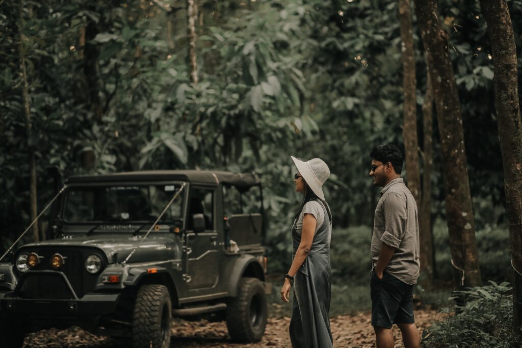 A couple walks happily towards their Jeep