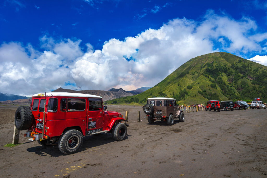 Several jeeps on a vast open field